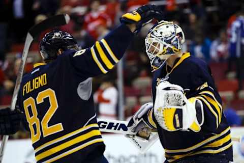 Dec 14, 2015; Detroit, MI, USA; Buffalo Sabres goalie Chad Johnson (31) celebrates with left wing Marcus Foligno (82) after the game against the Detroit Red Wings at Joe Louis Arena. Buffalo won 2-1. Buffalo won 2-1. Mandatory Credit: Rick Osentoski-USA TODAY Sports