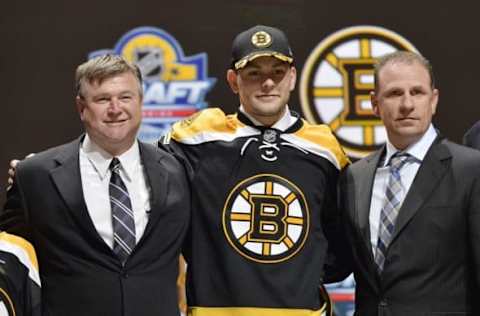 Jun 26, 2015; Sunrise, FL, USA; Jakub Zboril poses for a photo with team executives after being selected as the number thirteen overall pick to the Boston Bruins in the first round of the 2015 NHL Draft at BB&T Center. Mandatory Credit: Steve Mitchell-USA TODAY Sports