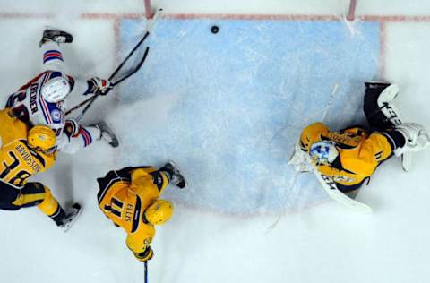 NHL Power Rankings: New York Rangers left wing Chris Kreider (20) shoots the puck wide of the net in overtime against the Nashville Predators at Bridgestone Arena. The Rangers won 2-1 in a shootout. Mandatory Credit: Christopher Hanewinckel-USA TODAY Sports