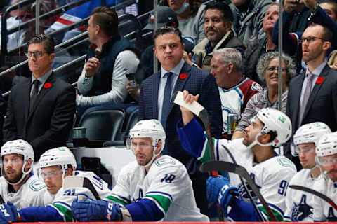 Nov 11, 2021; Denver, Colorado, USA; Vancouver Canucks head coach Travis Green looks on from the bench in the third period against the Colorado Avalanche at Ball Arena. Mandatory Credit: Isaiah J. Downing-USA TODAY Sports