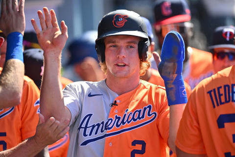 Jul 16, 2022; Los Angeles, CA, USA; American League Futures third baseman Gunnar Henderson (2) is greeted in the dugout after scoring a run in the first inning of the All Star-Futures Game at Dodger Stadium. Mandatory Credit: Jayne Kamin-Oncea-USA TODAY Sports