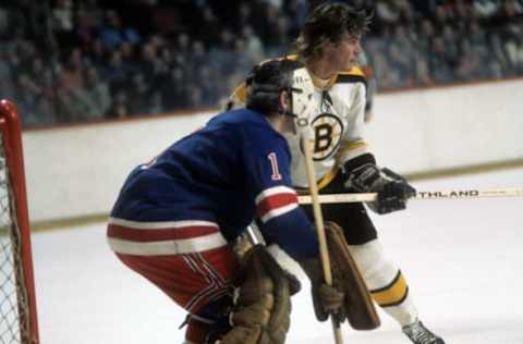 Garnet “Ace” Bailey of the Boston Bruins sets up in front of goalie Ed Giacomin of the New York Rangers during an NHL game circa 1972 at the Boston Garden in Boston, Massachusetts. (Photo by Melchior DiGiacomo/Getty Images)