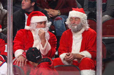 NEWARK, NJ – DECEMBER 23: Fans dressed as Santa Claus attend the game between the Carolina Hurricanes and the New Jersey Devils at the Prudential Center on December 23, 2014 in Newark, New Jersey. (Photo by Andy Marlin/NHLI via Getty Images)