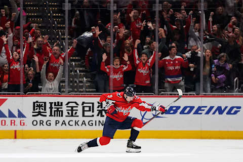 WASHINGTON, DC – NOVEMBER 29: Dmitry Orlov #9 of the Washington Capitals celebrates after scoring the game-winning goal in overtime against the Tampa Bay Lightning at Capital One Arena on November 29, 2019 in Washington, DC. (Photo by Patrick McDermott/NHLI via Getty Images)