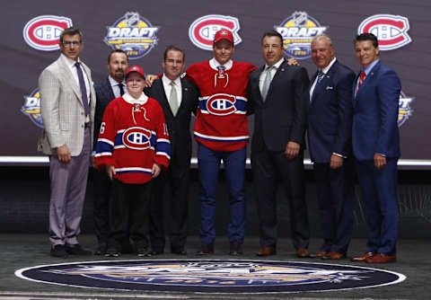 Jun 24, 2016; Buffalo, NY, USA; Mikhail Sergachev poses for a photo after being selected as the number nine overall draft pick by the Montreal Canadiens in the first round of the 2016 NHL Draft at the First Niagra Center. Mandatory Credit: Timothy T. Ludwig-USA TODAY Sports