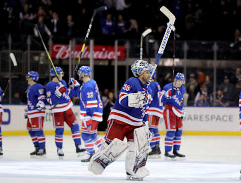 Henrik Lundqvist #30 of the New York Rangers and the rest of his teammates celebrate . (Photo by Elsa/Getty Images)