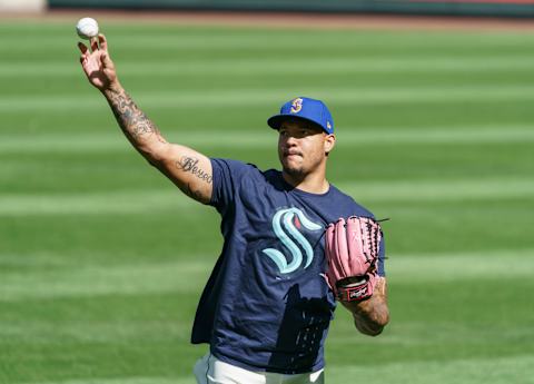 Wearing a Seattle Kraken shirt, Taijuan Walker #99 of the Seattle Mariners. (Photo by Stephen Brashear/Getty Images)