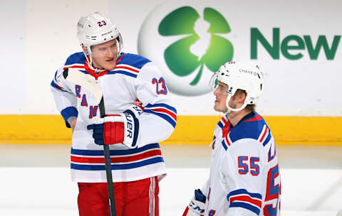 NEWARK, NEW JERSEY – APRIL 18: Adam Fox #23 and Ryan Lindgren #55 of the New York Rangers skate in warm-ups prior to the game against the New Jersey Devils at the Prudential Center on April 18, 2021 in Newark, New Jersey. (Photo by Bruce Bennett/Getty Images)