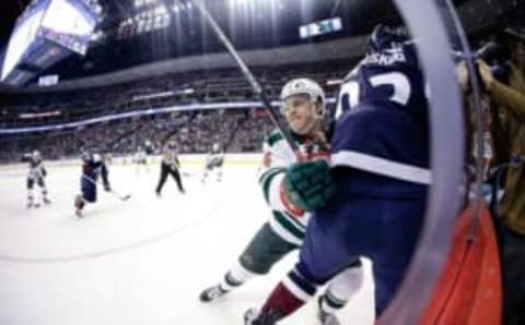 Nov 5, 2016; Denver, CO, USA; Minnesota Wild center Joel Eriksson Ek (14) checks Colorado Avalanche left wing Gabriel Landeskog (92) into the boards in the second period at the Pepsi Center. Mandatory Credit: Isaiah J. Downing-USA TODAY Sports