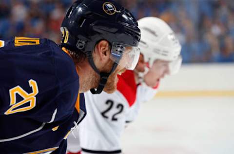 BUFFALO, NY – SEPTEMBER 19: Henrik Tallinder #20 of the Buffalo Sabres waits for a face-off against the Carolina Hurricanes at First Niagara Center on September 19, 2013, in Buffalo, New York. (Photo by Jen Fuller/Getty Images)