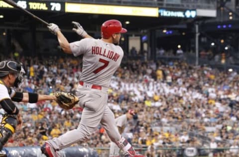 Jun 11, 2016; Pittsburgh, PA, USA; St. Louis Cardinals left fielder Matt Holliday (7) hits a three run home run against the Pittsburgh Pirates during the fifth inning at PNC Park. MLB. Mandatory Credit: Charles LeClaire-USA TODAY Sports