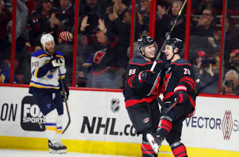 RALEIGH, NC – MARCH 1: Sebastian Aho #20 and Teuvo Teravainen #86 of the Carolina Hurricanes celebrate a goal by Aho against the St. Louis Blues during an NHL game on MARCH 1, 2019 at PNC Arena in Raleigh, North Carolina. (Photo by Karl DeBlaker/NHLI via Getty Images)