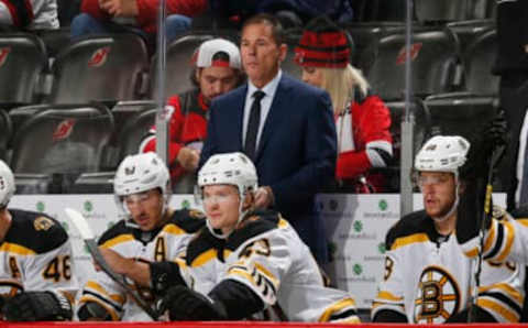 NEWARK, NJ – NOVEMBER 19: Head Coach Bruce Cassidy of the Boston Bruins looks on from behind the bench during the game against the New Jersey Devils at the Prudential Center on November 19, 2019 in Newark, New Jersey. (Photo by Andy Marlin/NHLI via Getty Images)