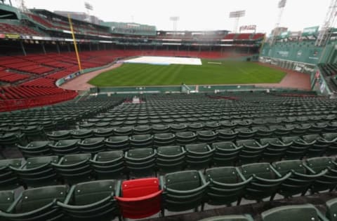 BOSTON, MA – OCTOBER 09: A red seat marking the spot where Ted Williams hit the longest home run in Fenway Park history is seen as rain falls after game three of the American League Divison Series between the Boston Red Sox and the Cleveland Indians was postponed due to weather at Fenway Park on October 9, 2016 in Boston, Massachusetts. (Photo by Elsa/Getty Images)