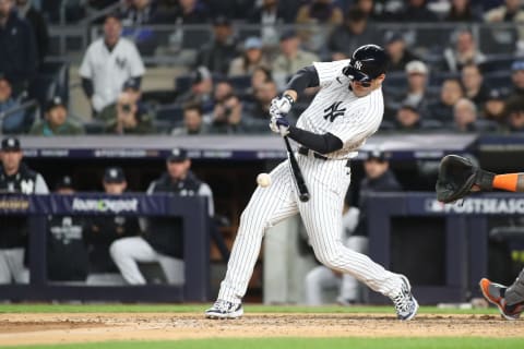 Oct 23, 2022; Bronx, New York, USA; New York Yankees first baseman Anthony Rizzo (48) hits an hits an RBI double in the second inning against the Houston Astros during game four of the ALCS for the 2022 MLB Playoffs at Yankee Stadium. Mandatory Credit: Wendell Cruz-USA TODAY Sports