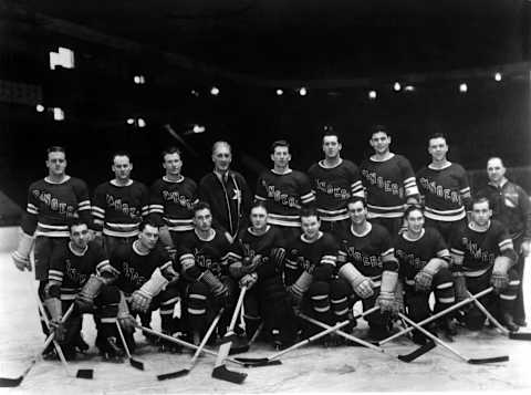 NEW YORK, NY – 1938: The New York Rangers pose for the team portrait circa 1938 at the Madison Square Garden in New York, New York. Top row: Lynn Patrick, coach Lester Patrick, Ott Heller, Muzz Patrick, Babe Pratt, Alex Shibicky and trainer Harry Winterly. Bottom row: Phil Watson, Art Coulter, Neil Coulville, goalie Dave Kerr and Clint Smith. (Photo by B Bennett/Getty Images)