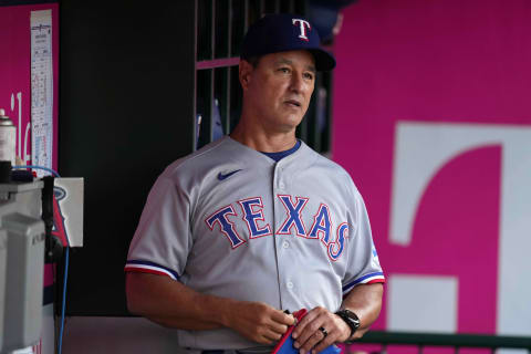 Sep 6, 2021; Anaheim, California, USA; Texas Rangers bench coach Don Wakamatsu (22) watches in the dugout during a game against the Los Angeles Angels at Angel Stadium. Mandatory Credit: Kirby Lee-USA TODAY Sports