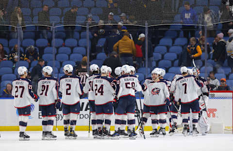 Feb 28, 2023; Buffalo, New York, USA; The Columbus Blue Jackets celebrate a win over the Buffalo Sabres at KeyBank Center. Mandatory Credit: Timothy T. Ludwig-USA TODAY Sports