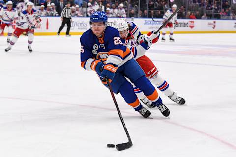 Apr 21, 2022; Elmont, New York, USA; New York Rangers left wing Artemi Panarin (10) chases New York Islanders defenseman Sebastian Aho (25) during the first period at UBS Arena. Mandatory Credit: Dennis Schneidler-USA TODAY Sports