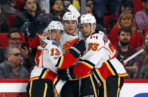 The Calgary Flames’ Micheal Ferland (79) celebrates his goal with Johnny Gaudreau (13) and Sean Monahan (23) during the second period against the Carolina Hurricanes on Sunday, Feb. 26, 2017 at PNC Arena in Raleigh, N.C. (Chris Seward/Raleigh News Observer/TNS via Getty Images)