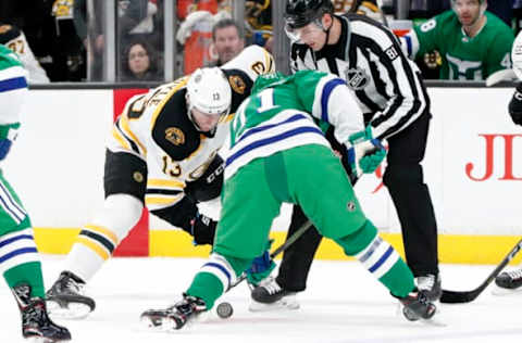 BOSTON, MA – MARCH 05: Boston Bruins center Charlie Coyle (13) and Carolina Hurricanes center Lucas Wallmark (71) face off during a game between the Boston Bruins and the Carolina Hurricanes on March 5, 2019, at TD Garden in Boston, Massachusetts. (Photo by Fred Kfoury III/Icon Sportswire via Getty Images)