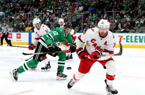 DALLAS, TEXAS – FEBRUARY 11: Corey Perry #10 of the Dallas Stars skates for the puck against Jaccob Slavin #74 of the Carolina Hurricanes in the first period at American Airlines Center on February 11, 2020 in Dallas, Texas. (Photo by Ronald Martinez/Getty Images)