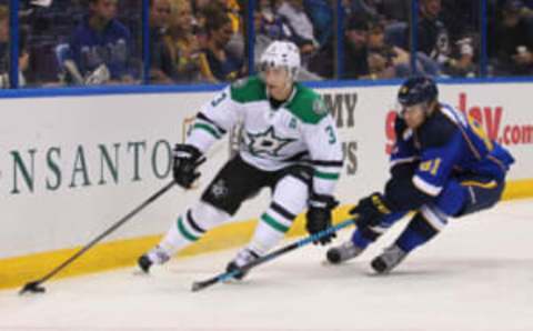 ST. LOUIS, MO – SEPTEMBER 21: Stephane Robidas #3 of the Dallas Stars controls the puck against Sergei Andronov #81 of the St. Louis Blues during a preseason at the Scottrade Center on September 21, 2013 in St. Louis, Missouri. The Blues beat the Stars 3-2 in overtime. (Photo by Dilip Vishwanat/Getty Imag es)