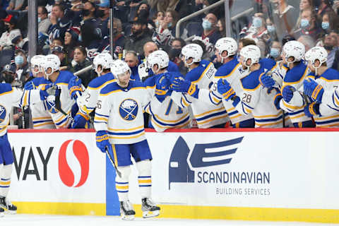 Dec 14, 2021; Winnipeg, Manitoba, CAN; Buffalo Sabres forward Anders Bjork (96) is congratulated by his teammates on his goal against the Winnipeg Jets during the second period at Canada Life Centre. Mandatory Credit: Terrence Lee-USA TODAY Sports