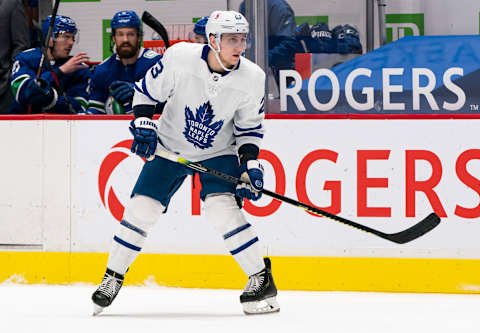 VANCOUVER, BC – MARCH 04: Travis Dermott #23 of the Toronto Maple Leafs skates with the puck during NHL hockey action against the Vancouver Canucks at Rogers Arena on March 4, 2021 in Vancouver, Canada. (Photo by Rich Lam/Getty Images)