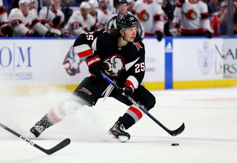 Apr 13, 2023; Buffalo, New York, USA; Buffalo Sabres defenseman Owen Power (25) skates with the puck and looks to make a pass during the second period against the Ottawa Senators at KeyBank Center. Mandatory Credit: Timothy T. Ludwig-USA TODAY Sports