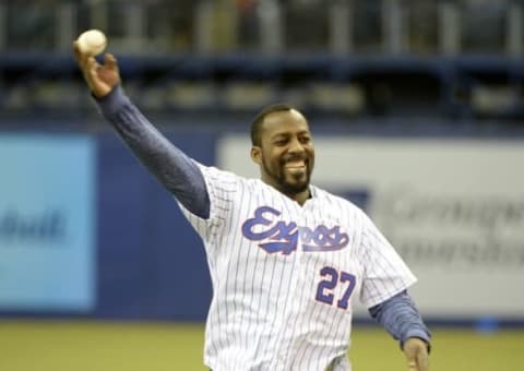 Apr 3, 2015; Montreal, Quebec, CAN; Former Expos Vladimir Guerrero throws the first pitch before the game between the Cincinnati Reds and the Toronto Blue Jays at the Olympic Stadium. Mandatory Credit: Eric Bolte-USA TODAY Sports