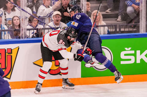 TAMPERE, FINLAND - MAY 29: Pierre-Luc Dubois of Canada (L) against Marko Anttila of Finland (R) during the 2022 IIHF Ice Hockey World Championship match between Finland and Canada at Nokia Arena on May 29, 2022 in Tampere, Finland. (Photo by Jari Pestelacci/Eurasia Sport Images/Getty Images)