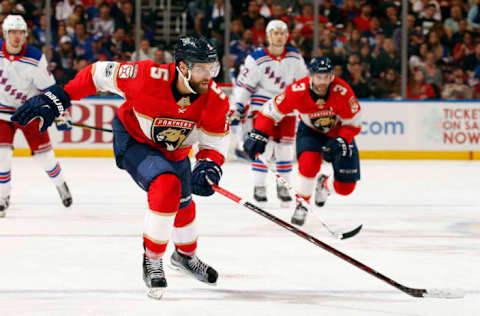 SUNRISE, FL – NOVEMBER 4: Aaron Ekblad (#5) hustles to retrieve the puck with Keith Yandle (#3) against New York