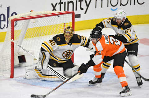 Feb 5, 2021; Philadelphia, Pennsylvania, USA; Philadelphia Flyers left wing Scott Laughton (21) is defended by Boston Bruins defenseman Jakub Zboril (67) in front of goaltender Tuukka Rask (40) during the third period at Wells Fargo Center. Mandatory Credit: Eric Hartline-USA TODAY Sports