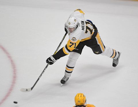 Jun 5, 2017; Nashville, TN, USA; Pittsburgh Penguins center Evgeni Malkin (71) takes a shot against the Nashville Predators during the third period in game four of the 2017 Stanley Cup Final at Bridgestone Arena. Mandatory Credit: Scott Rovak-USA TODAY Sports