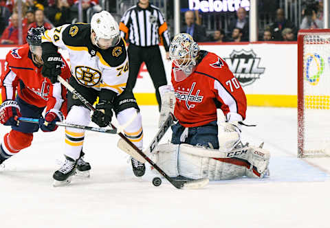 WASHINGTON, DC – FEBRUARY 03: Washington Capitals goaltender Braden Holtby (70) makes a first period save on s shot by Boston Bruins left wing Jake DeBrusk (74) on February 3, 2019, at the Capital One Arena in Washington, D.C. (Photo by Mark Goldman/Icon Sportswire via Getty Images)