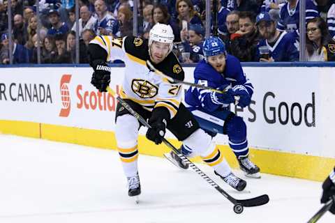 TORONTO, ON – APRIL 21: Boston Bruins Defenceman John Moore (27) clears the puck away from Toronto Maple Leafs Right Wing William Nylander (29) during the third period of Game 6 of the First Round Stanley Cup Playoffs series between the Boston Bruins and the Toronto Maple Leafs on April 21, 2019, at Scotiabank Arena in Toronto, ON. (Photo by Julian Avram/Icon Sportswire via Getty Images)