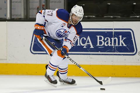 Apr 6, 2017; San Jose, CA, USA; Edmonton Oilers left wing Benoit Pouliot (67) controls the puck against the San Jose Sharks during the first period at SAP Center at San Jose. The Edmonton Oilers defeated the San Jose Sharks 4-2. Mandatory Credit: Stan Szeto-USA TODAY Sports