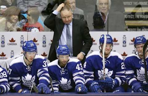 Jan 18, 2014; Toronto, Ontario, CAN; Toronto Maple Leafs head coach Randy Carlyle looks on from the bench against the Montreal Canadiens at Air Canada Centre. Mandatory Credit: Tom Szczerbowski-USA TODAY Sports