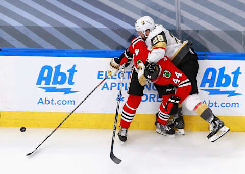 William Carrier #28 of the Vegas Golden Knights attempts to get past Calvin de Haan #44 of the Chicago Blackhawks during the third period in Game Four of the Western Conference First Round. (Photo by Jeff Vinnick/Getty Images)