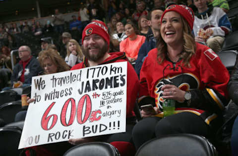 DENVER, CO – JANUARY 02: (L-R) Stefan and Amanda Hofmeister of Galgary, Alberta, Canada display a sign in support of Jarome Iginla