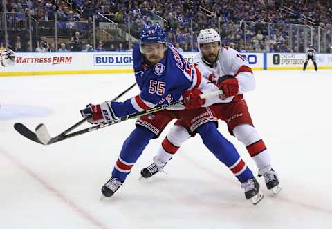 NEW YORK, NEW YORK – MAY 28: Ryan Lindgren #55 of the New York Rangers and Vincent Trocheck #16 of the Carolina Hurricanes pursue the puck during the first period in Game Six of the Second Round of the 2022 Stanley Cup Playoffs at Madison Square Garden on May 28, 2022, in New York City. (Photo by Bruce Bennett/Getty Images)