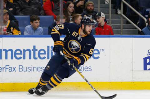 Mar 21, 2017; Buffalo, NY, USA; Buffalo Sabres defenseman Brady Austin (67) skates with the puck against the Pittsburgh Penguins at KeyBank Center. Mandatory Credit: Timothy T. Ludwig-USA TODAY Sports