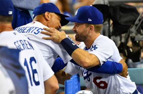 LOS ANGELES, CA – JULY 31: Los Angeles Dodgers second baseman Brian Dozier (6) hugs his new manager Dave Roberts in the dugout during a MLB game between the Milwaukee Brewers and the Los Angeles Dodgers on July 3, 2018 at Dodger Stadium in Los Angeles, CA. (Photo by Brian Rothmuller/Icon Sportswire via Getty Images)