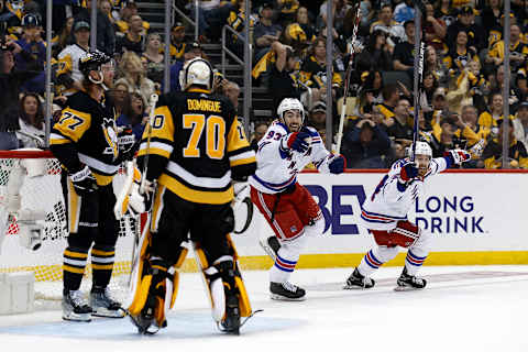 PITTSBURGH, PA – MAY 13: Jeff Carter #77 of the Pittsburgh Penguins and Louis Domingue #70 stand in the net as Mika Zibanejad #93 of the New York Rangers and Tyler Motte #64 react after Chris Kreider #20 scored the game winning goal during the third period in Game Six of the First Round of the 2022 Stanley Cup Playoffs at PPG PAINTS Arena on May 13, 2022 in Pittsburgh, Pennsylvania. New York defeated Pittsburgh 5-3. (Photo by Kirk Irwin/Getty Images)