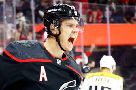 RALEIGH, NORTH CAROLINA – MAY 19: Sebastian Aho #20 of the Carolina Hurricanes celebrates following a goal scored during the first period in Game Two of the First Round of the 2021 Stanley Cup Playoffs against the Nashville Predators at PNC Arena on May 19, 2021, in Raleigh, North Carolina. (Photo by Jared C. Tilton/Getty Images)