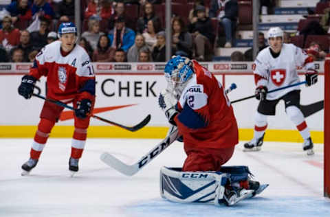 VANCOUVER, BC – DECEMBER 26: Goalie Lukas Dostal #2 of the Czech Republic makes a save as Ondrej Machala #17 of the Czech Republic and Nicolas Muller #9 of Switzerland looks on in Group A hockey action of the 2019 IIHF World Junior Championship action on December 26, 2018, at Rogers Arena in Vancouver, British Columbia, Canada. (Photo by Rich Lam/Getty Images)