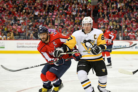 WASHINGTON, DC – NOVEMBER 10: Washington Capitals left wing Alex Ovechkin (8) and Pittsburgh Penguins center Sidney Crosby (87) fight for a second period puck on November 10, 2017, at the Capital One Arena in Washington, D.C. (Photo by Mark Goldman/Icon Sportswire via Getty Images)