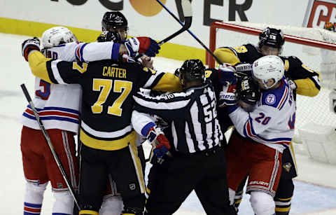 Feb 26, 2022; Pittsburgh, Pennsylvania, USA; The New York Rangers and the Pittsburgh Penguins get into a scrum after the whistle during the second period at PPG Paints Arena. Mandatory Credit: Charles LeClaire-USA TODAY Sports