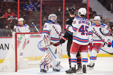 Feb 20, 2022; Ottawa, Ontario, CAN; New York Rangers goalie Igor Shesterkin (31) makes a save in front of Ottawa Senators left wing Brady Tkachuk (7) in the second period at the Canadian Tire Centre. Mandatory Credit: Marc DesRosiers-USA TODAY Sports